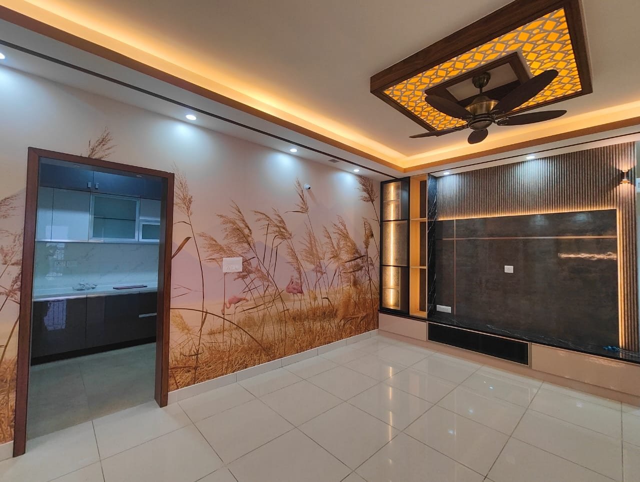 POP false ceiling with continuous warm cove lighting in a Bangalore living room